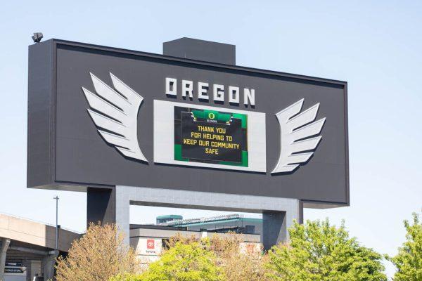 <p>A large sign hangs over Autzen to encourage and congratulate those who are doing their part to keep the community safe. University of Oregon begins to distribute Vaccines to Students and Faculty on April 21, 2021. (Maddie Stellingwerf/Emerald)</p>