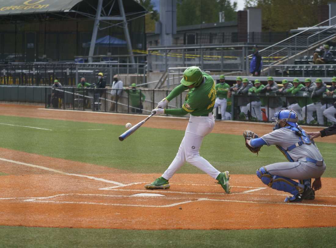 Ducks outfielder/first base Anthony Hall (35) swings and hits a Bruins pitch. Oregon Ducks baseball takes on UCLA Bruins at PK Park in Eugene, Ore., on April 25, 2021. (Kevin Wang/Daily Emerald)