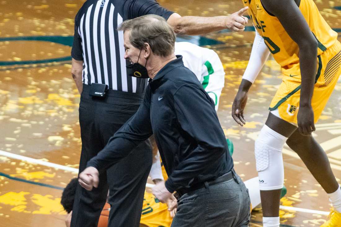 Ducks head coach Dana Altman celebrates after a foul is called on the Dons. Oregon Ducks take on San Francisco Dons at Matthew Knight Arena in Eugene, Ore., on Dec. 17, 2020. (Kimberly Harris/Emerald)