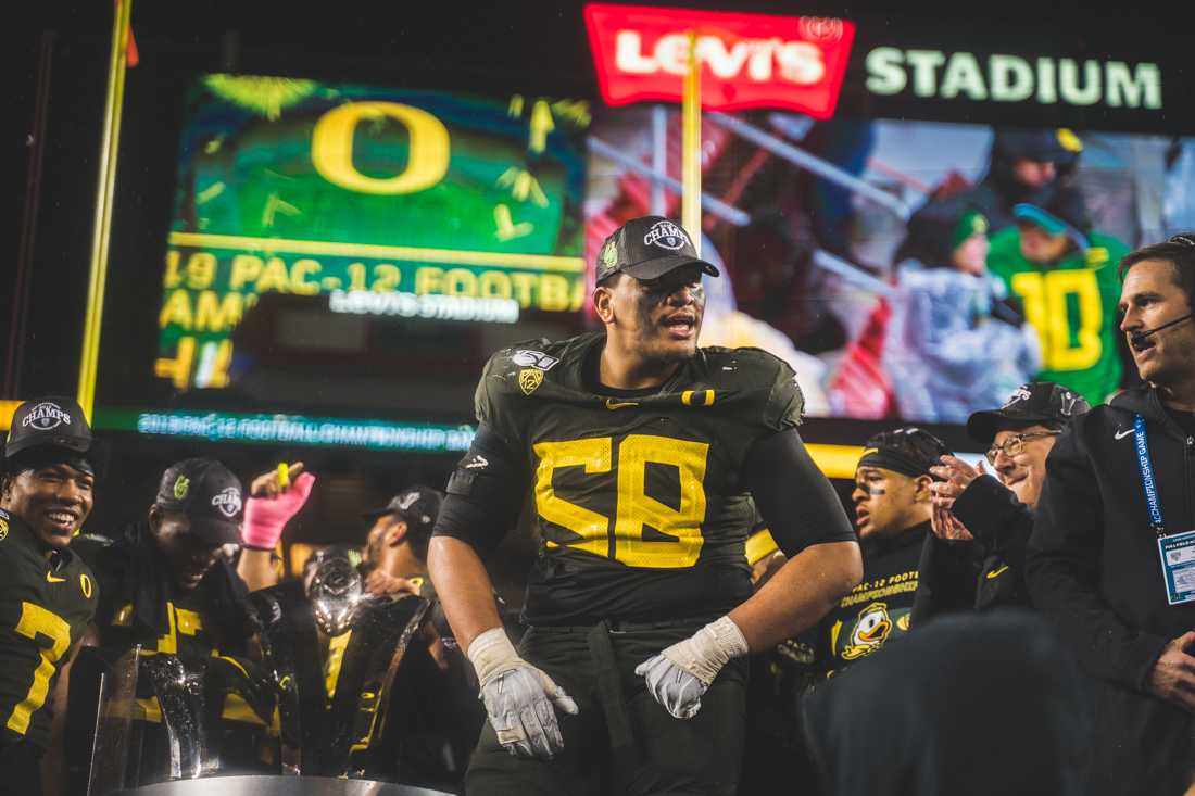 Ducks offensive lineman Penei Sewell (58) flexes in celebration. Oregon Ducks football takes on Utah for the Pac 12 Championship game at Levi's Stadium in Santa Clara, Calif. on Dec. 6, 2019. (DL Young/Emerald)