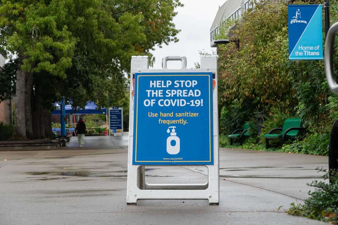 A sign informs people to continue sanitizing thier hands is placed in the middle of Lane Community College's campus. Lane Community College has decided to continue with remote learning through the fall. (Serei Hendrie/ Emerald)