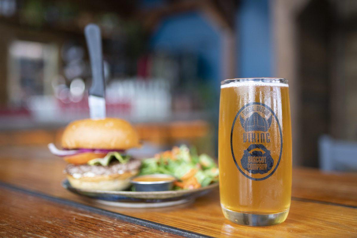 A burger and a beer at Viking Braggot in Eugene, Ore. on September 28, 2021. The Daily Emerald reviews a variety of Eugene area bars for the coming school year. (Isaac Wasserman/ Emerald)