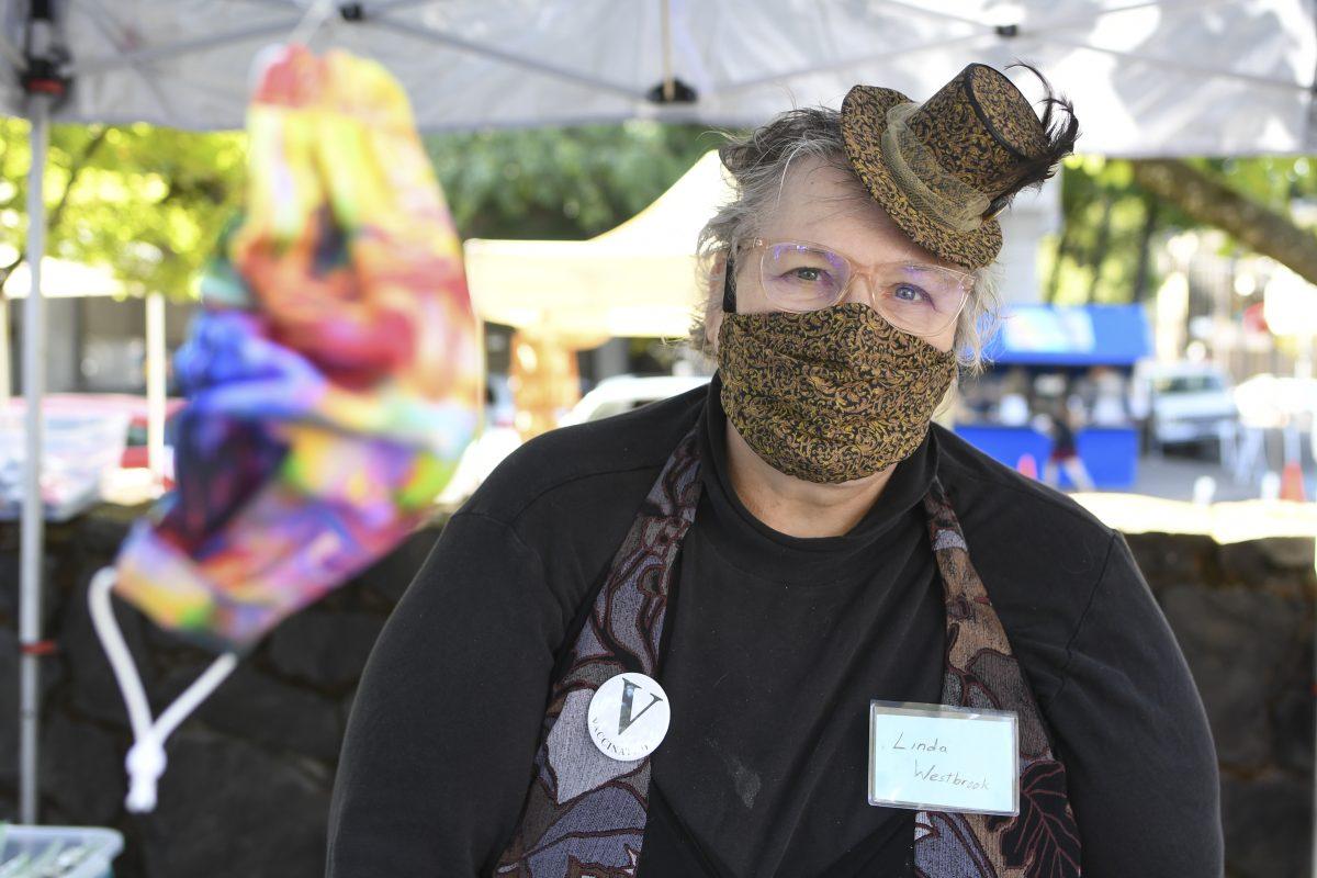 &#8220;Last year I started making masks. That&#8217;s pretty much all I did in 2020,&#8221; said vendor Linda Avalon Westbrook. &#8220;I spent hours a day trying to save the world one mask at a time.&#8221; Eugene Saturday Market and its vendors, who have faced the challenge of navigating the past year, as seen in Eugene, Ore. on September 11, 2021 (Isaac Wasserman/ Emerald)