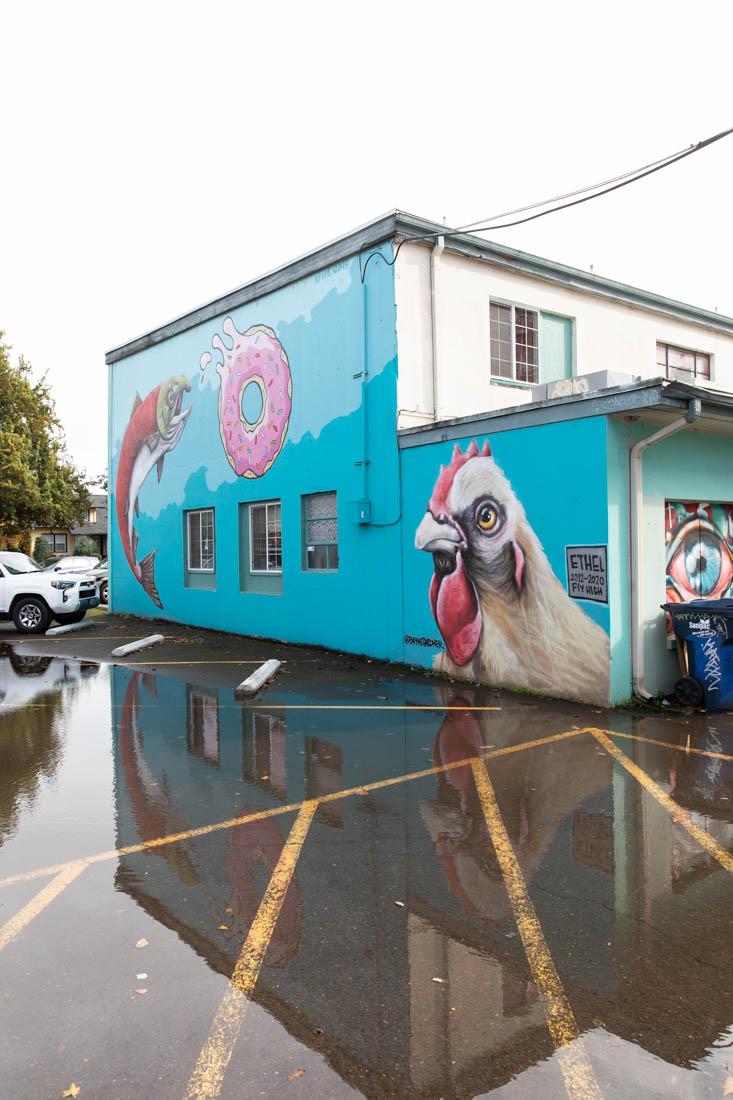 Bayne Gardner is a muralist based in the lane county area, one of his many pieces "20x21" lays on the corner of 13th and Willamette. Murals are a large part of lane counties artistic expression (Maddie Stellingwerf/Emerald).