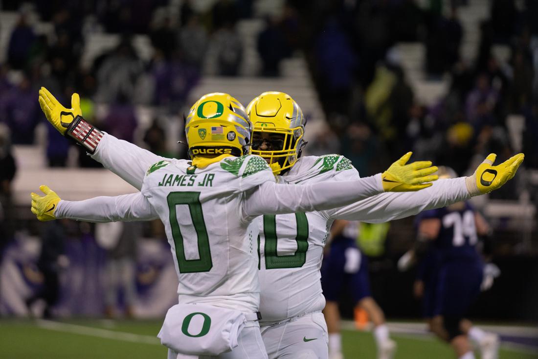 After forcing a safety from a snap, Ducks cornerback, DJ James (0), goes to celebrate with a teammate. The Oregon Ducks take on the Washington Huskies at Husky Stadium in Seattle, Wash., on November 6, 2021. (Serei Hendrie/Emerald)