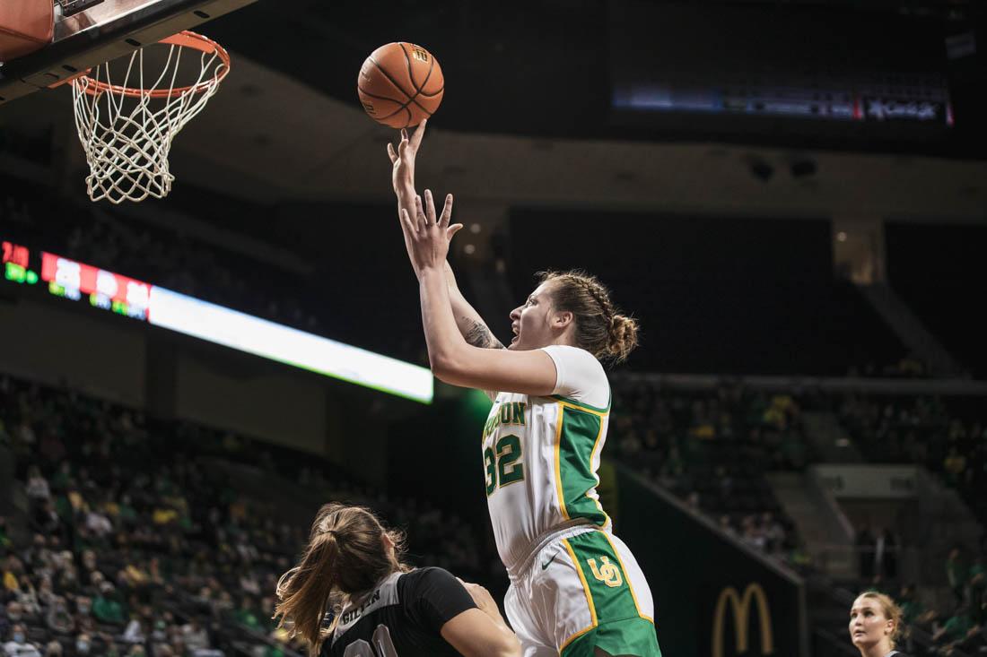 Ducks forward Sedona Prince (32) attempts a shot over Trailblazers guard Breaunna Gillen (20). Ducks Womens Basketball take on Dixie State Trailblazers at Matthew Knight Arena in Eugene, Ore., on Nov. 14, 2021 (Maddie Stellingwerf/Emerald).