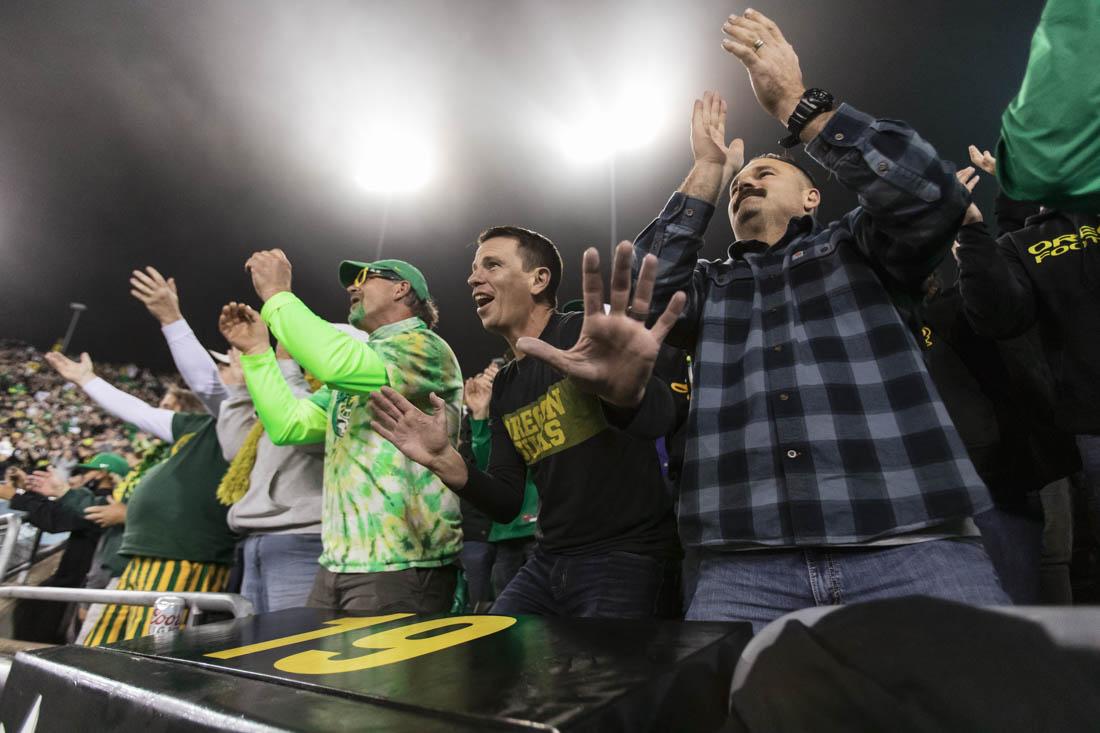 Fans dance and sing joyously during the playing of 'Shout' in between the third and final quarter. Ducks football take on the Washington State Cougars at Autzen Stadium in Eugene, Ore., on Nov. 13, 2021. (Maddie Stellingwerf)