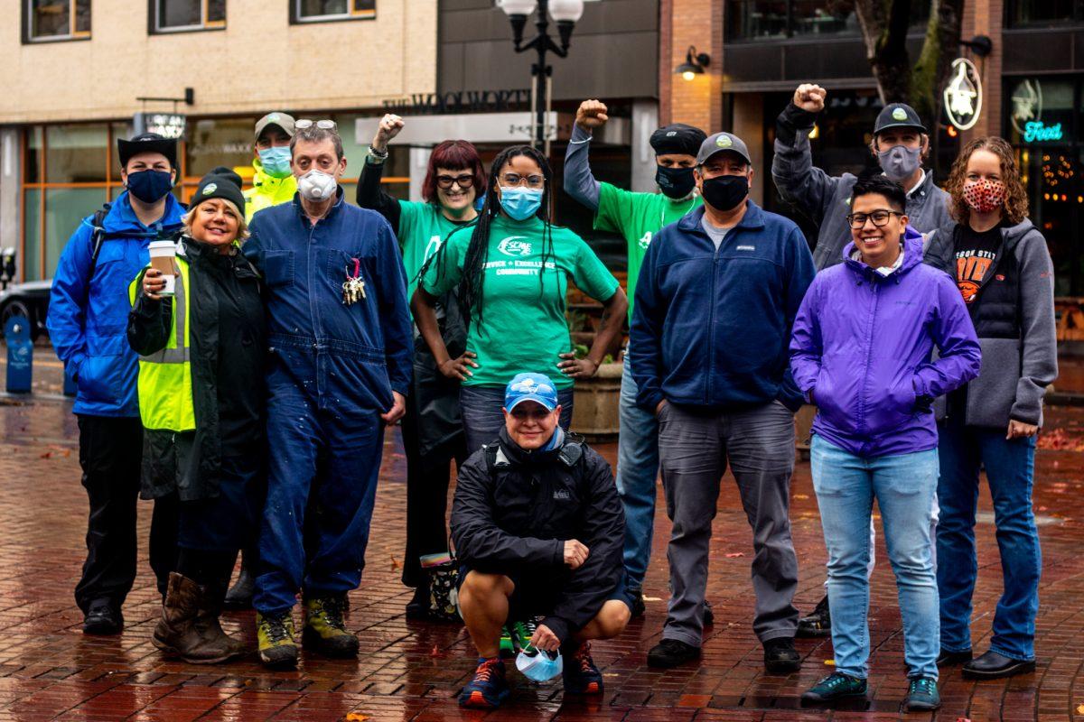 Members from the AFSCME Local 1724 union pose for a photo in Kesey Square on Friday morning, November 5, 2021. AFSCME Local 1724 members are currently fighting for for a fair contract from the city of Eugene, seeking higher cost of living adjustments, more equity on benefits, and improved job security. (Will Geschke/Emerald)