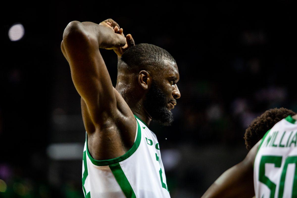 Sweat drips from the face of Franck Kepnang (22) during an Oregon timeout. The Oregon Ducks defeated the Southern Methodist University Mustangs 86-63 at Matthew Knight Arena on November 12, 2021. (Will Geschke/Emerald)