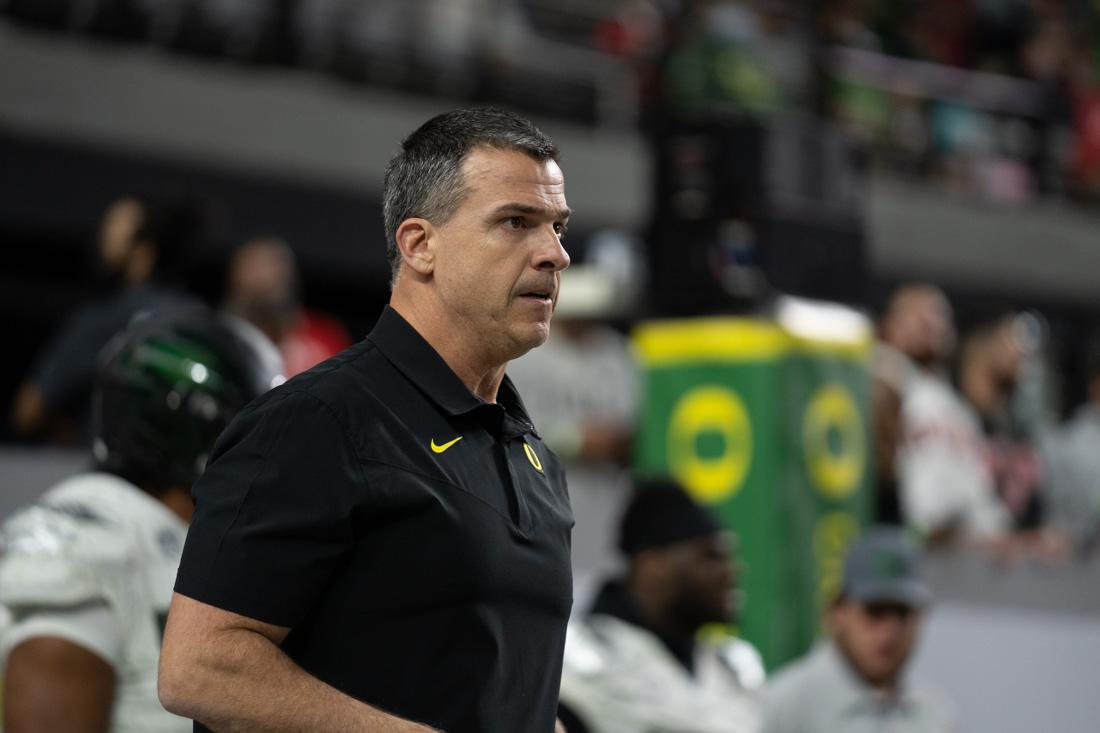 Mario Cristobal works with the Defense during pre-game warmups. The Oregon Ducks take on the Utah Utes at Allegiant Stadium in Las Vegas, Nev., on December 3, 2021. (Serei Hendrie/Emerald)