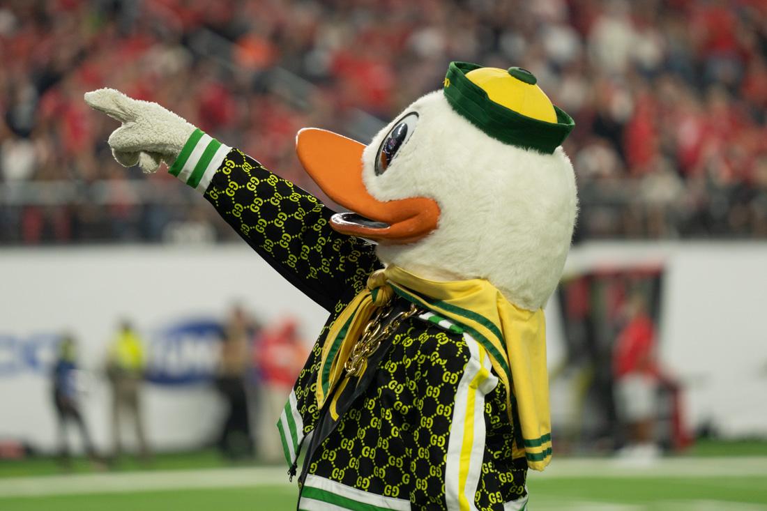 <p>The Duck points to the crowd of Oregon fans that showed up in Las Vegas for the Pac-12 championship game. The Oregon Ducks take on the Utah Utes at Allegiant Stadium in Las Vegas, Nev., on December 3, 2021. (Serei Hendrie/Emerald)</p>