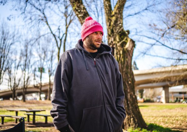 Andrew Lima (shown here) is a former nurse and used to live at Washington Jefferson Park. He still comes here most days to see his friend Andrew Trimble. Washington Jefferson Park, which has served as a sanctioned campsite for unhoused people for a year, will be closed by the city of Eugene soon. (Will Geschke/Emerald)