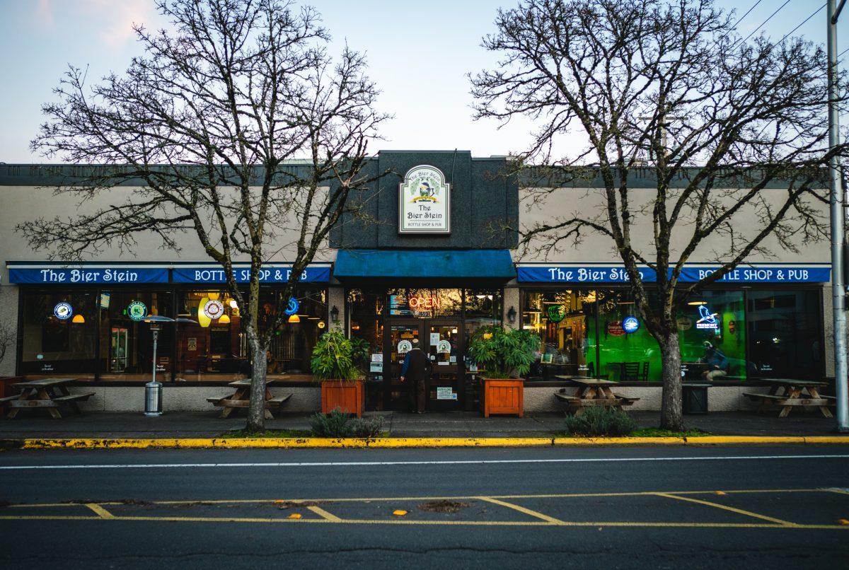 A customer walks into the Bier Stein in the early evening. The Bier Stein is a local pub and beer shop on Willamate Ave. in Eugene, Oregon. (Will Geshcke/Emerald)