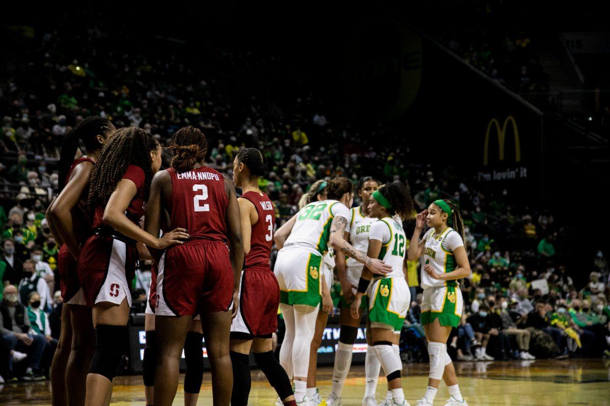 Both teams gather as Oregon plans their attack on what would be their last possession. The Oregon Ducks Women&#8217;s Basketball team faces the Stanford Cardinal, on February 20th, 2022, at Matthew Knight Arena. (Liam Sherry/Emerald)