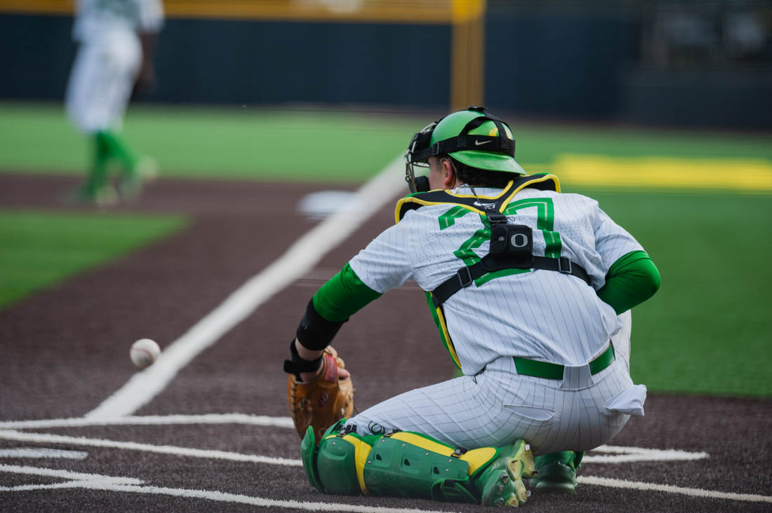 Catcher Josiah Cromwick (27) warms up in between innings. Oregon Baseball takes on the University of San Fransisco at PK Field in Eugene, Ore. on March 29, 2022. (Mary Grosswendt/Emerald)