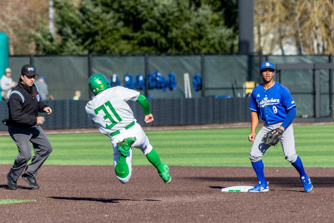 Tanner Smith (31) begins his slide into second base. The Oregon Ducks Baseball team takes on UCSB on March 5th, 2022, at PK Park. (Molly McPherson/Emerald)