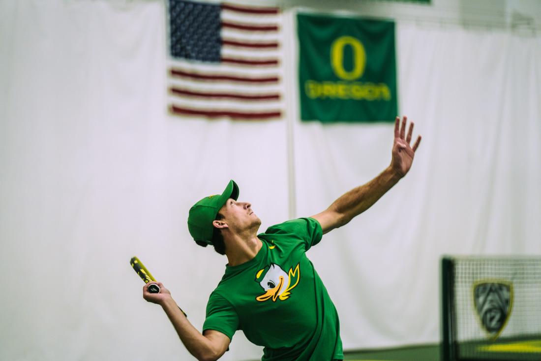 Luke Vandecasteele winds up for a serve in Men's Singles. The Oregon Ducks Mens&#8217;s Tennis team plays the Portland Pilots, on March 13th, 2022, at the University of Oregon. (Serei Hendrie/Emerald)