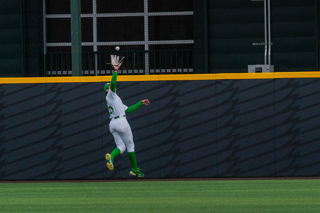 Outfielder Anthony Hall (35) jumps up to catch the ball. Oregon Baseball takes on the University of San Fransisco at PK Field in Eugene, Ore. on March 29, 2022. (Mary Grosswendt/Emerald)