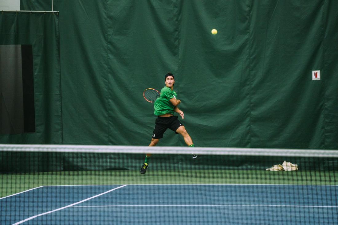 Ryoma Matsushita returns a serve. The Oregon Ducks Mens&#8217;s Tennis team plays the Portland Pilots, on March 13th, 2022, at the University of Oregon. (Serei Hendrie/Emerald)