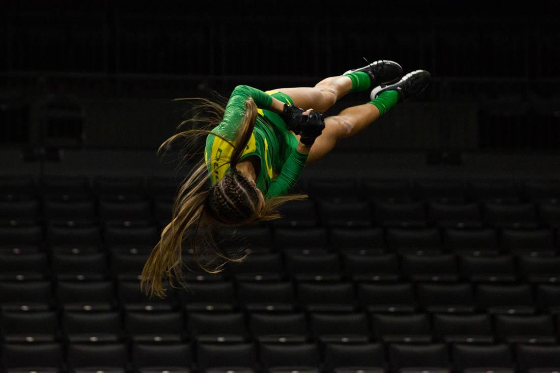 An Oregon Duck catches flight. The Oregon Ducks take on the Gannon Knights in an Acrobatics and Tumbling meet. (Ali Watson/Emerald)