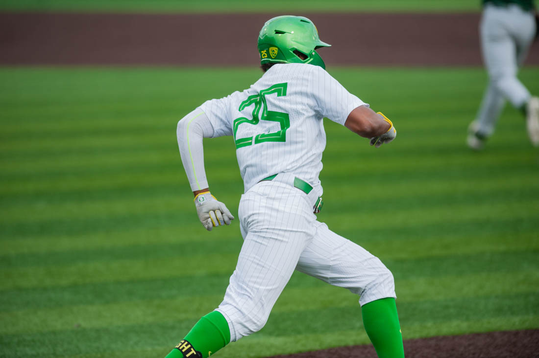 Jacob Walsh (25) rounds first base after a hit into the outfield. Oregon Baseball takes on the University of San Fransisco at PK Field in Eugene, Ore. on March 29, 2022. (Mary Grosswendt/Emerald)