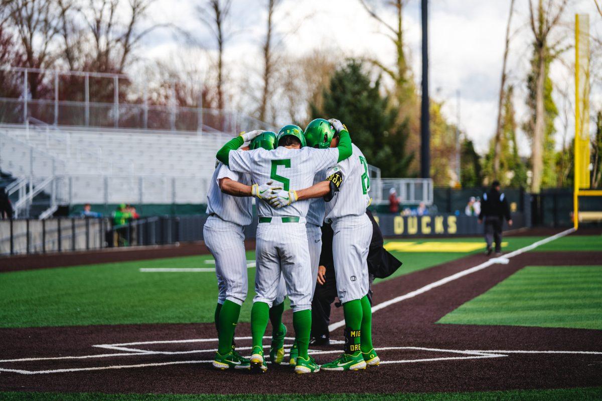 Oregon Ducks players celebrate after hitting a home run. The University of Oregon Ducks staged a late-game comeback to win 8-6 against the Utah Utes on March 19, 2022 at PK Park. (Will Geschke/Emerald)