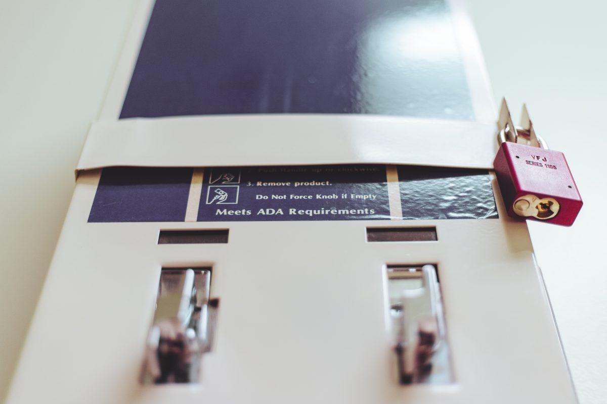 A menstrual product dispenser in a UO bathroom. (Sarah Northrop/Emerald)