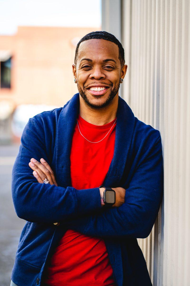 Kyle Rodriguez-Hudson poses for a portrait outside of the Transponder offices, located in downtown Eugene. Transponder is a nonprofit located in Eugene that offers support services and common items needed to assist transgender people in the Oregon community. (Will Geschke/Emerald)