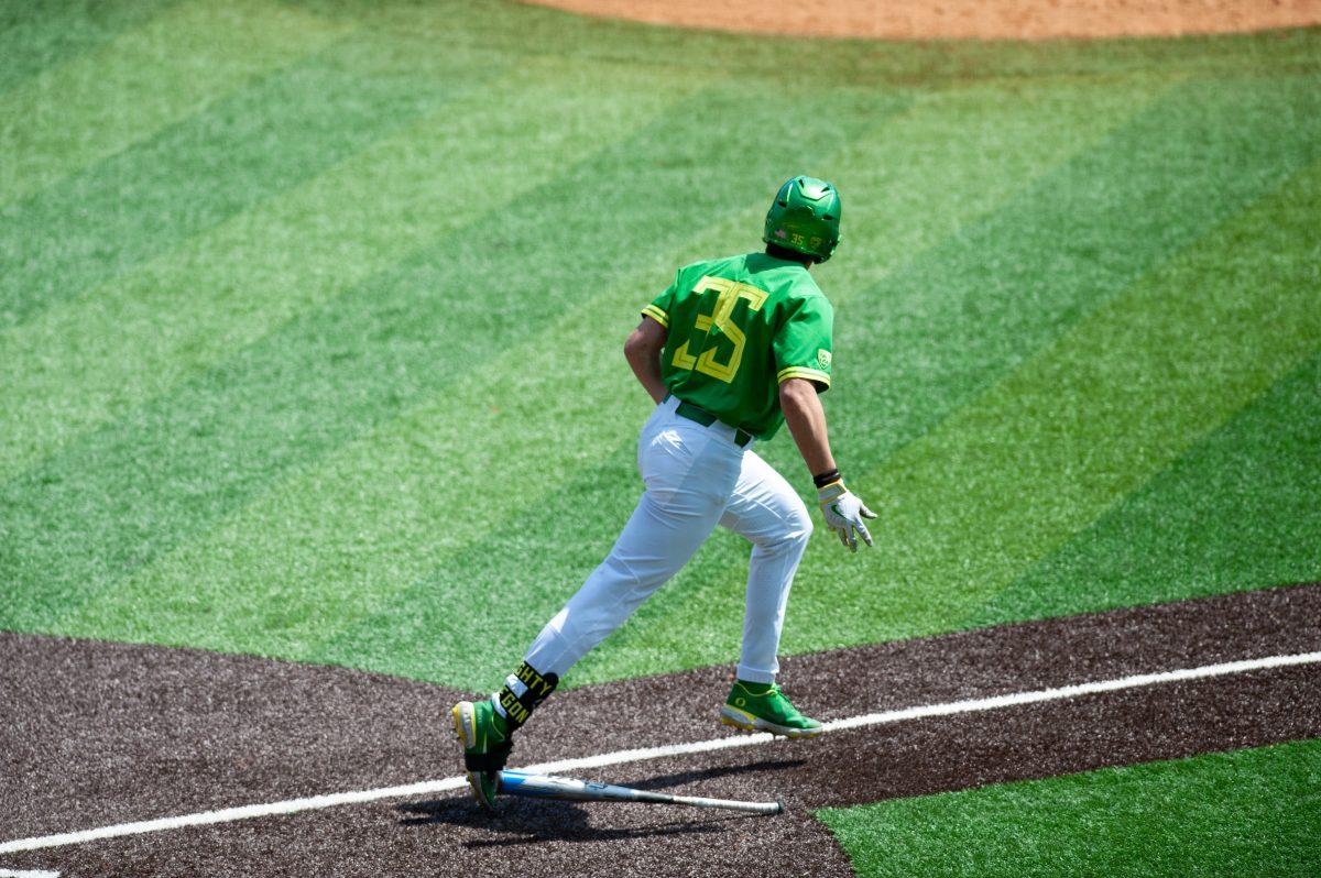 Anthony Hall drops his bat as he watches his ball hit well into the outfield. The Oregon Ducks Baseball team hosts Washington State at PK Park on April 24th, 2022. (Liam Sherry/Emerald)