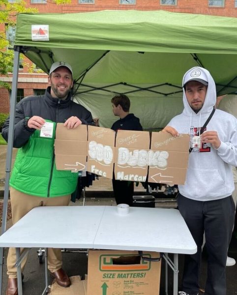 Erik Kilgore (left), who runs a non-profit called Henry’s Uncle that centers on ending the stigma of addiction and raising awareness about illicit fentanyl, and Nathan Smiddy (right), a member of the non-profit A New PATH with a similar mission to Henry’s Uncle, handed out free Narcan and held trainings on how to use it at the ASUO Street Faire. (Photo courtesy of Erik Kilgore)