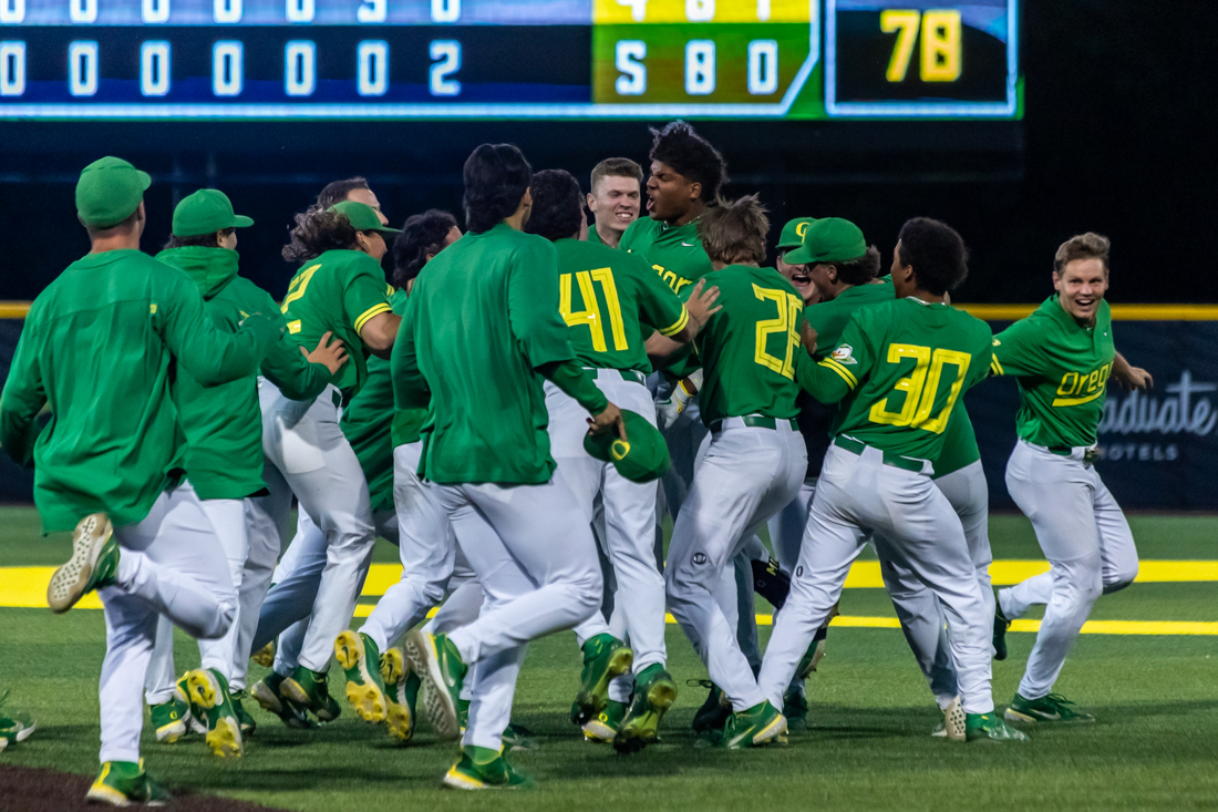 The Ducks celebrate their win in the outfield. The Oregon Baseball team takes on 11th ranked Gonzaga on May 17th, 2022, at PK Park. (Molly McPherson/Emerald)