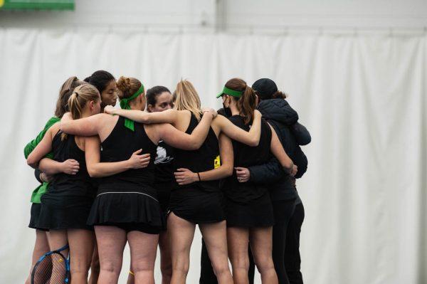 The Ducks gather around for a pep talk before their next set. UO Women’s Tennis takes on Portland State at the UO Student Tennis Center on Jan. 16th, 2022 (Mary Grosswendt/Emerald)