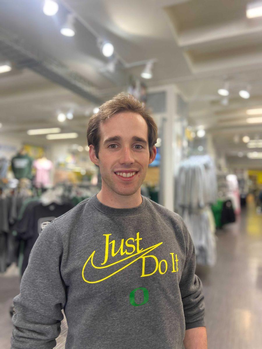 Connor Canter, a graduating senior, smiles inside of the Duck Store. (Brandon Roth/ Emerald)