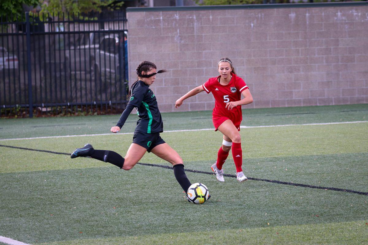 Kaitlyn Paculba (9) prepares to center the ball to her teammates at the goal.&#160;The Oregon Ducks Soccer Team host Western Oregon at Pape Field on May 7, 2022. (Jonathan Suni).