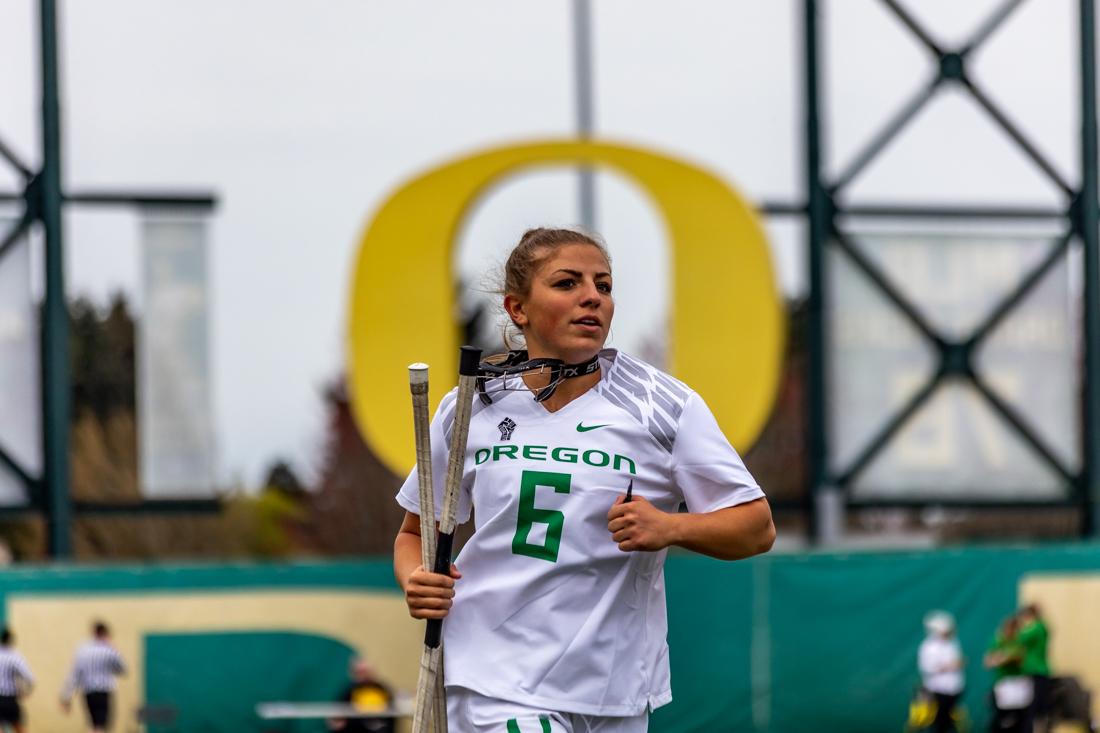 Gabby Cleveland (06) runs to the locker room during halftime. The Oregon Lacrosse team takes on USC on April 17th, 2022, at Pap&#233; Field. (Molly McPherson/Emerald)