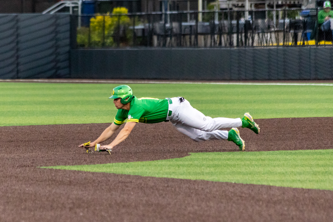 Drew Cowley (15) dives into second base. The Oregon baseball team takes on Gonzaga on May 17, 2022, at PK Park. (Molly McPherson/Emerald)