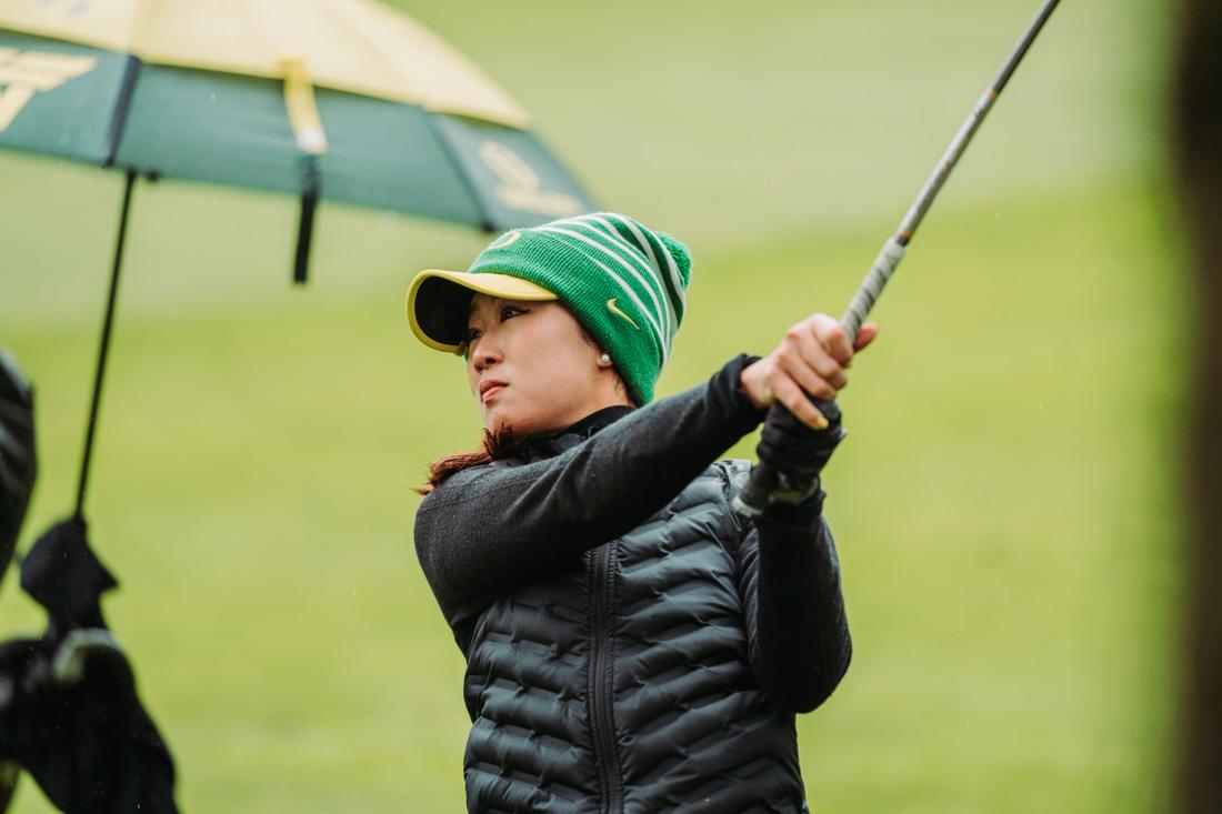 Oregon's Heather Lin chips her ball out from behind a tree on a approach shot towards the green. The Eugene Country Club hosted the Pac-12 Women's golf championships from April 18-20, 2022. (Serei Hendrie/ Emerald)