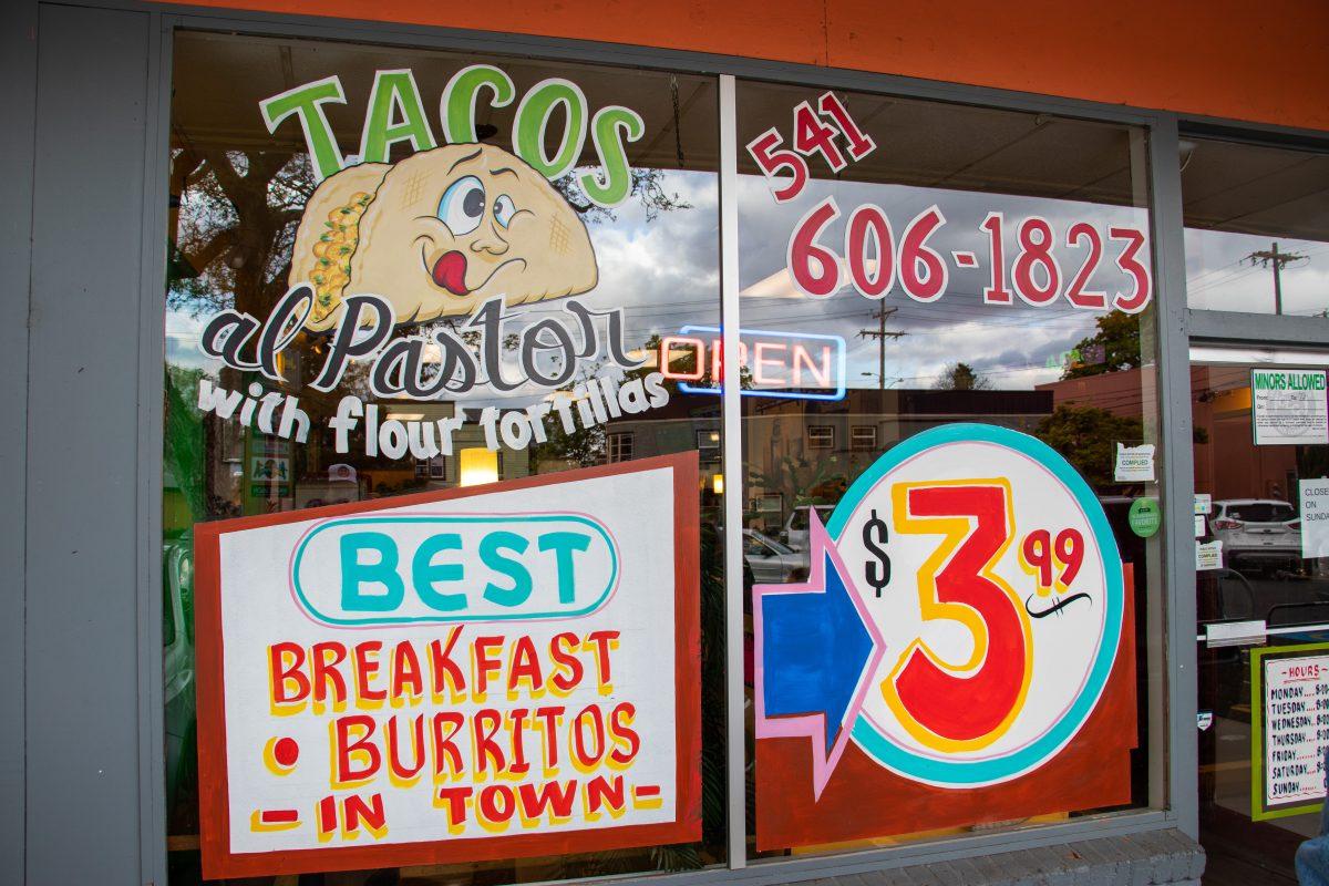 Mama Myra's Kitchen's bright and colorful signs attract anyone who may look their way. (Jonathan Suni, Emerald)