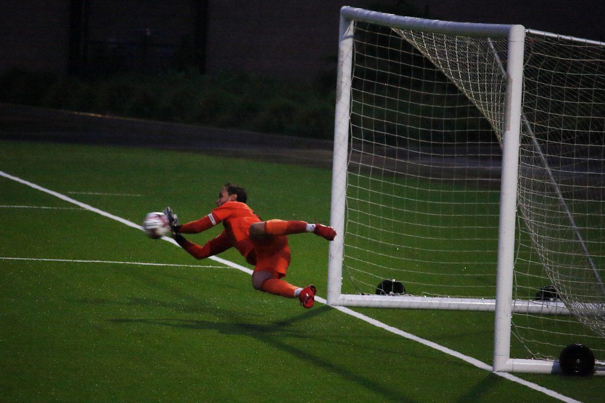 <p>Lane United FC goalkeeper Albert Escuín leaps to save a Ballard FC shot. The Lane United FC Reds take on Ballard FC at Civic Park in Eugene, Ore., on Friday, June 17. (Peter Bellerby/NW Sports Pics)</p>