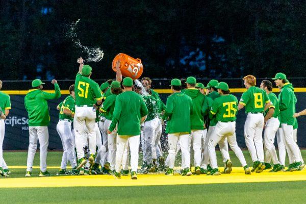 The Ducks celebrate their win in the outfield. The Oregon Baseball team takes on 11th ranked Gonzaga on May 17th, 2022, at PK Park. (Molly McPherson/Emerald)