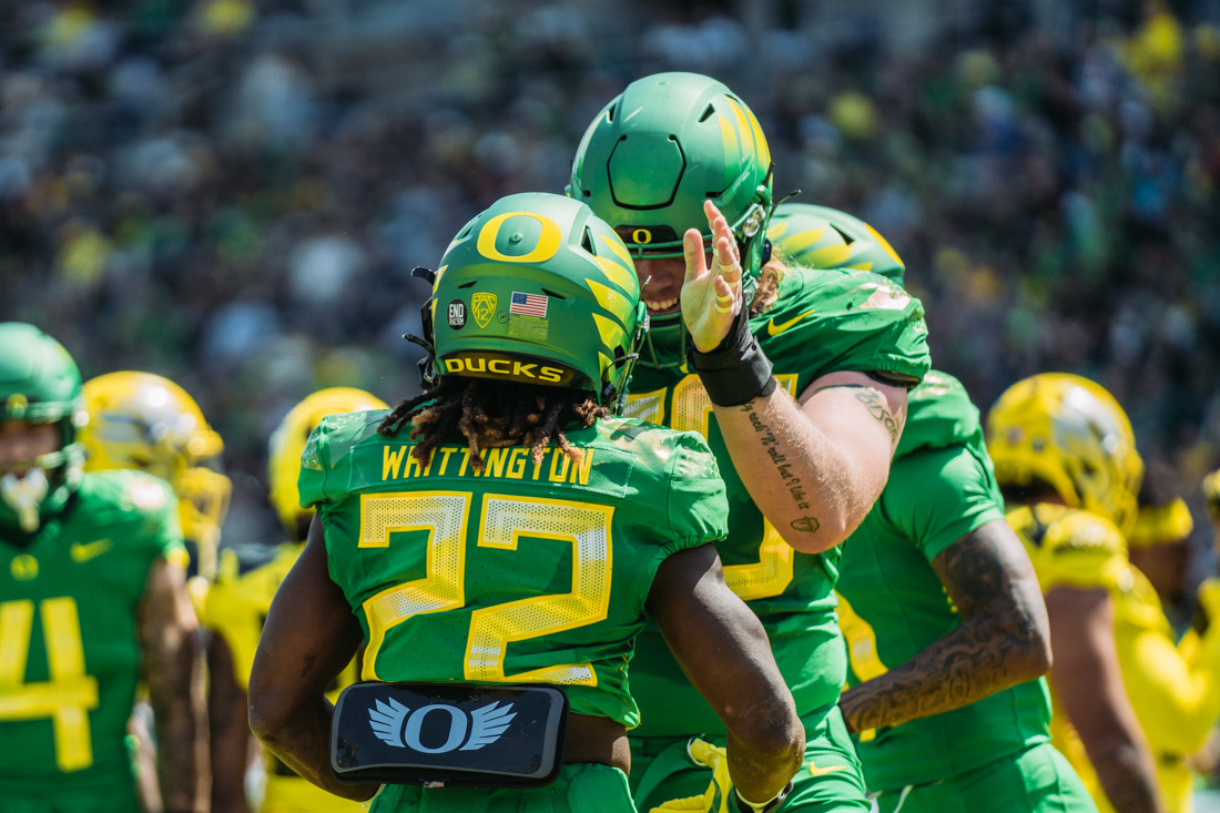 Noah Whittington (22) celebrates with a teamate after running the ball for a touchdown. The Oregon Football team competes in it's annual spring game on April 23rd, 2022 at Autzen Stadium in Eugene, Ore. (Serei Hendrie/Emerald)