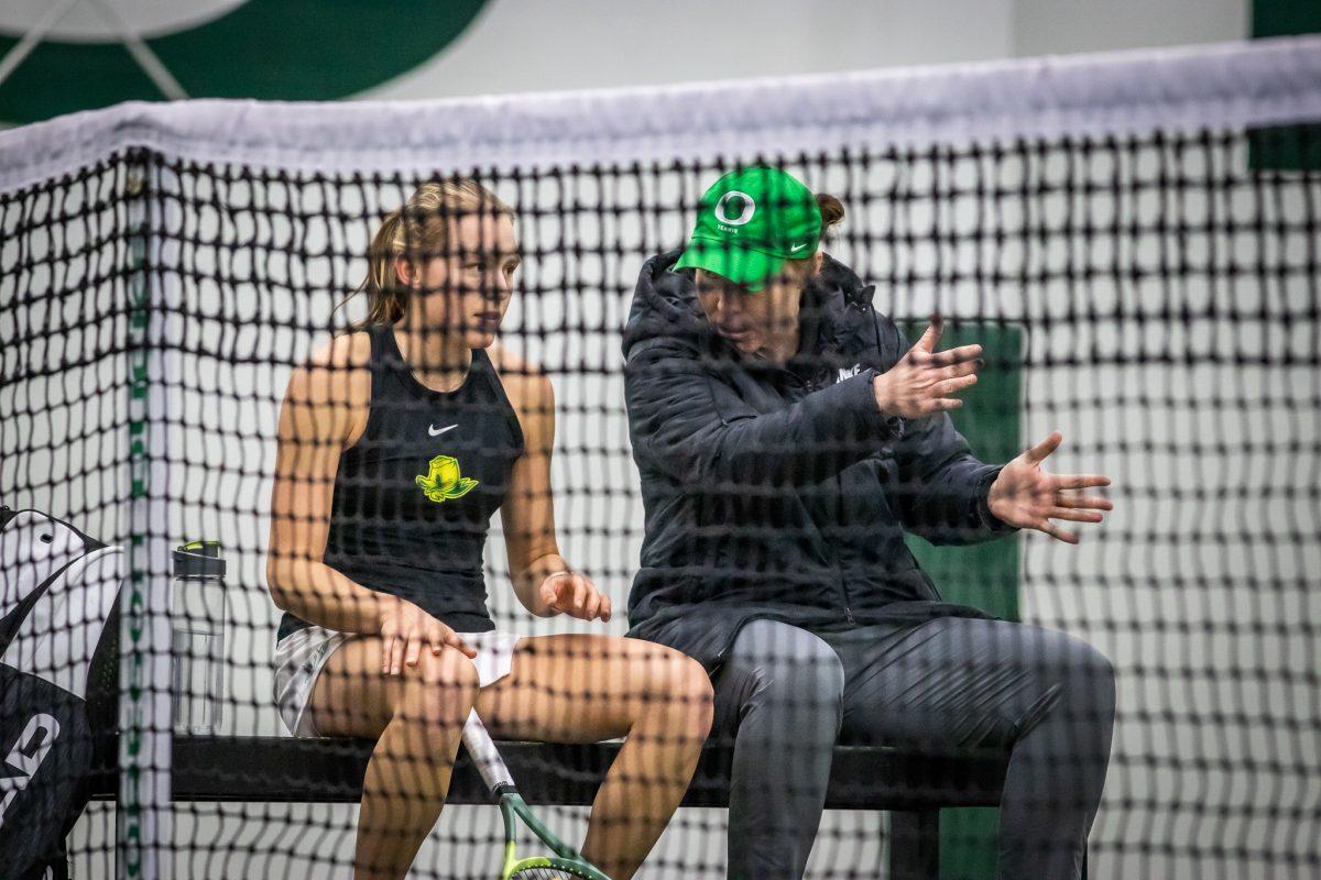 Coach Nagle gives pointers to Sophie Luescher in between sets.&#160;The Oregon Women's Tennis team hosts Portland State at the Student Tennis Center in Eugene, Ore., on January 20th. (Jonathan Suni, Emerald)