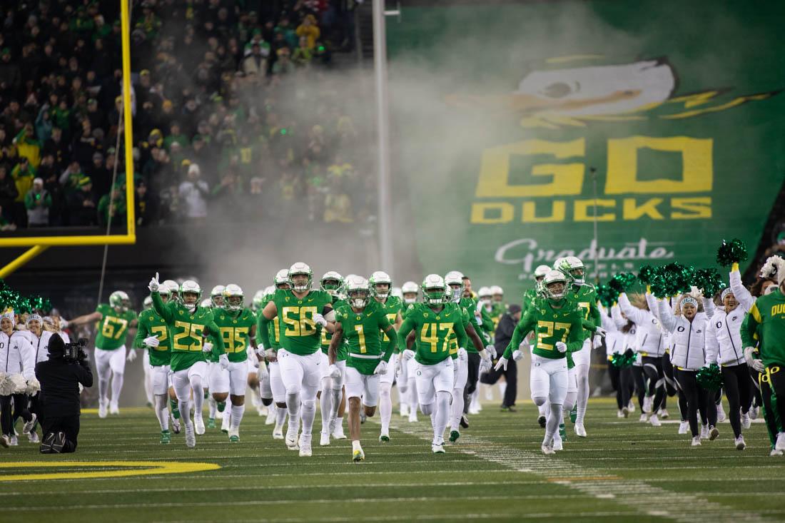 The Oregon football team rushes out of the tunnel prior to kickoff. The Oregon Ducks take on the University of Utah Utes at Autzen Stadium in Eugene, Ore., on Nov. 19, 2022 (Maddie Stellingwerf/Emerald)