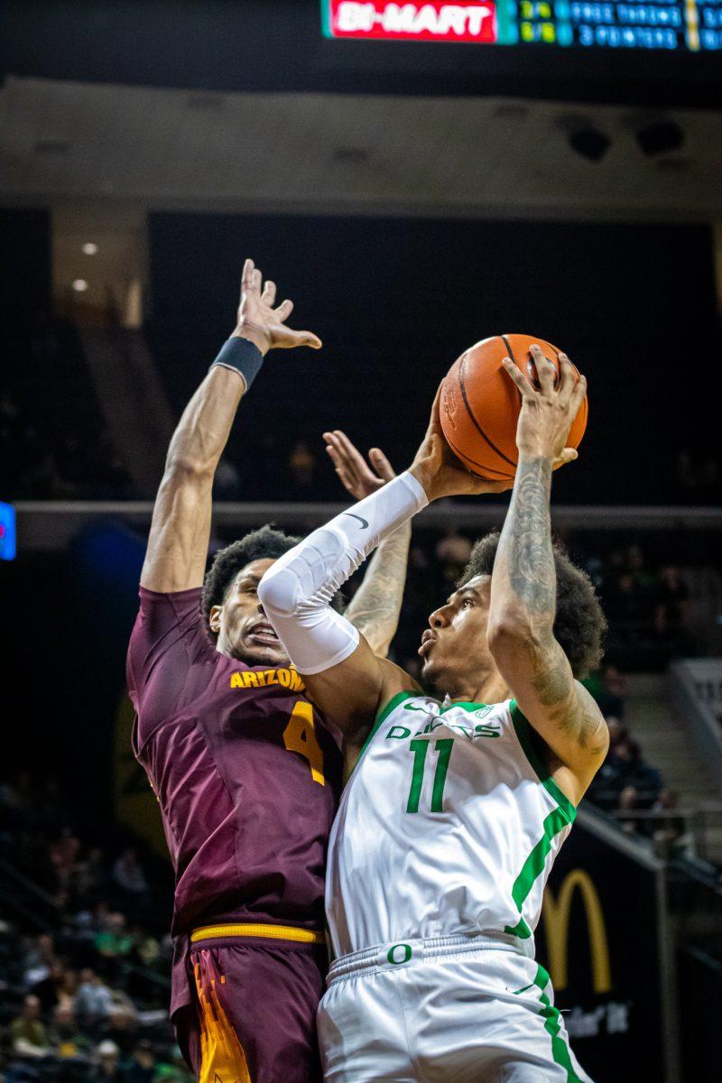 <p>Rivaldo Soares (11) rises up and takes contact from an ASU defender. <span>The University of Oregon Ducks host the Arizona State Sun Devils at Matthew Knight Arena in Eugene, Ore., on Jan. 12, 2023. (Jonathan Suni, Emerald)</span></p>