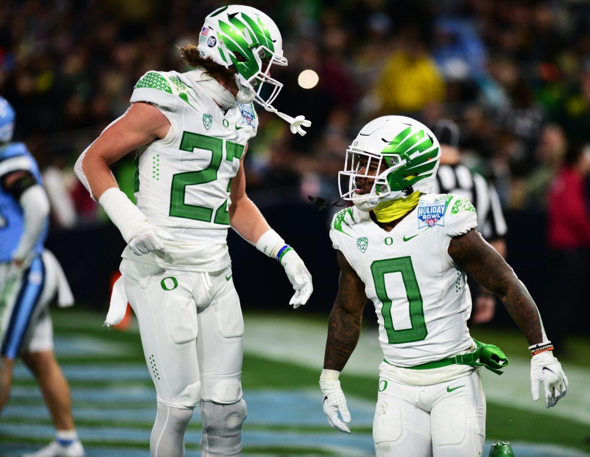 Oregon wide receiver Chase Cota (23) and Bucky Irving (0) celebrate a touchdown against North Carolina on Wednesday, Dec. 28, 2022 at Petco Park in San Diego. Irving rushed for 149 yards and two touchdowns, and was crowned the offensive player of the game.&#160;