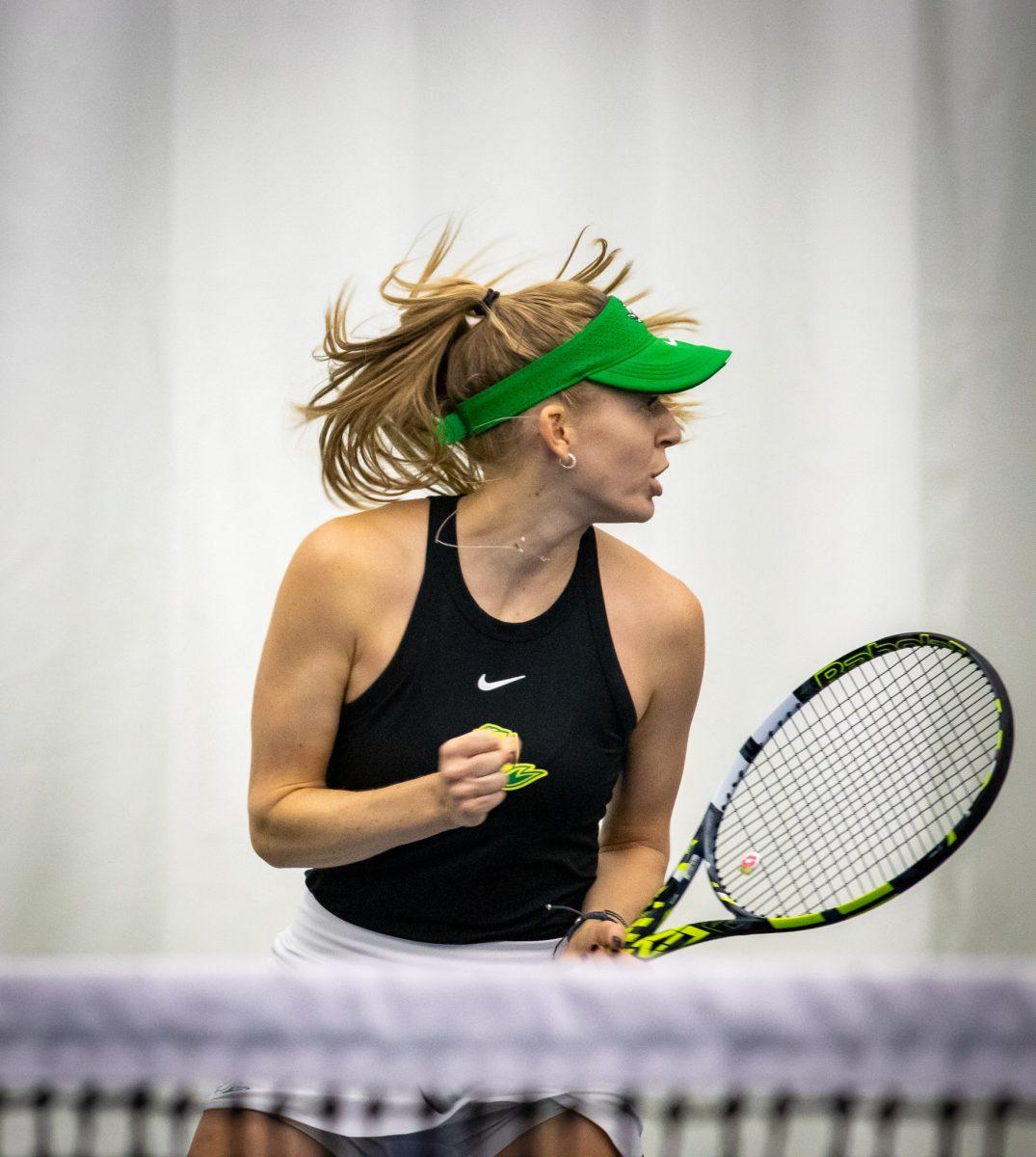 Myah Petchey pumps her fist and celebrates after earning a point.&#160;The Oregon Women's Tennis team hosts Portland State at the Student Tennis Center in Eugene, Ore., on January 20th. (Jonathan Suni, Emerald)