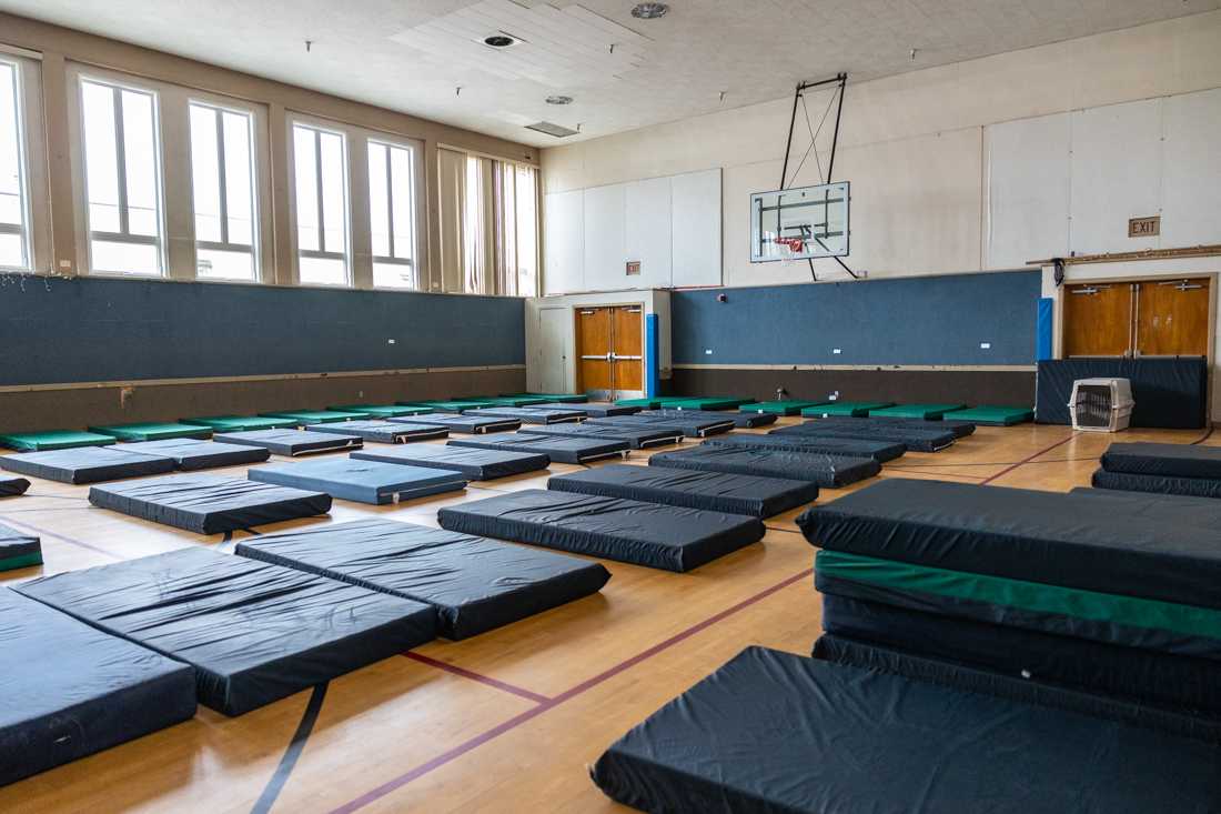 This particular center used to be a recreation center, the basketball gymnasium now serves as the sleeping area for guests. Upon arrival guests receive a blanket to take to their mattress. First United Methodist, Egan Youth Site is located on A St. in Springfield Ore. (Molly McPherson/Emerald)