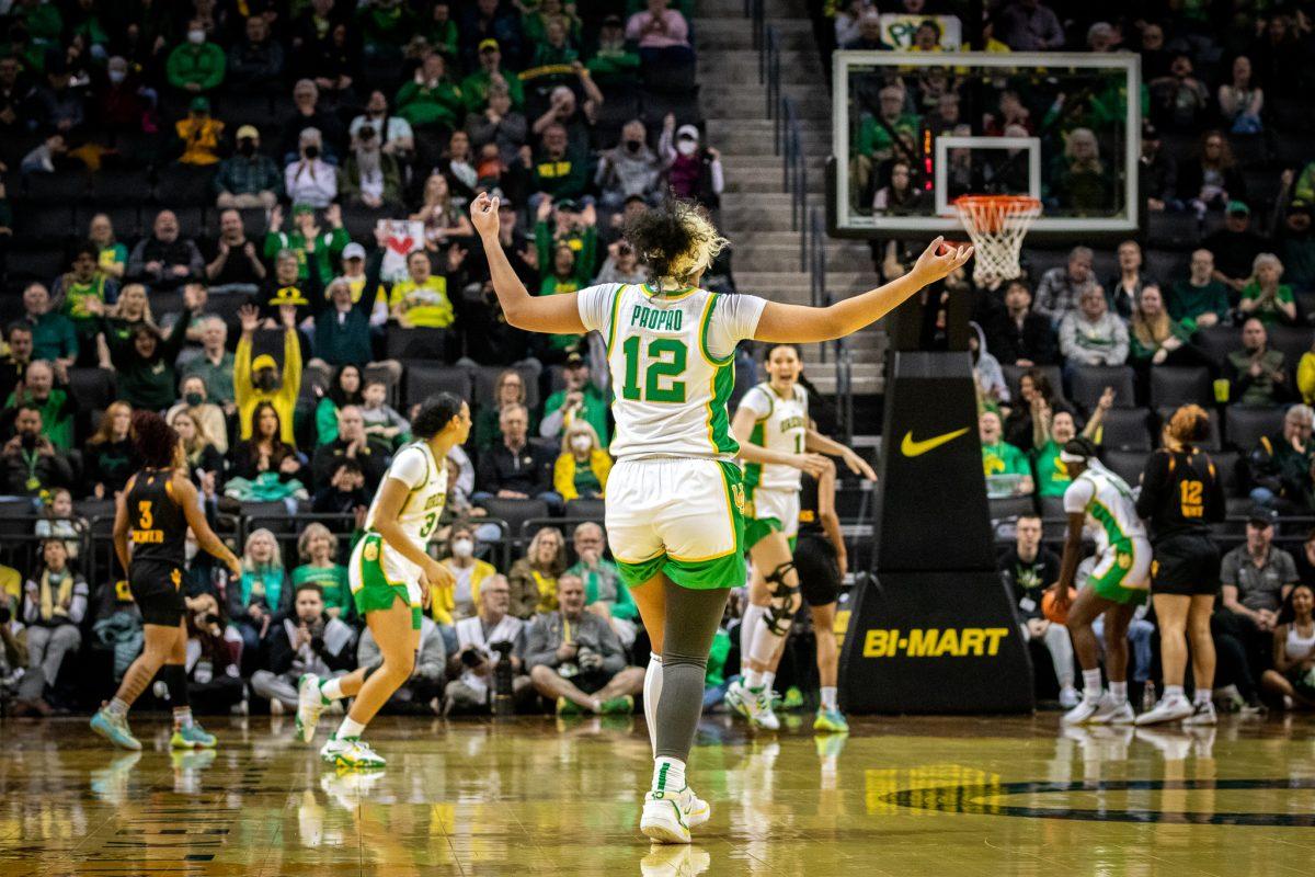 Te-Hina Paopao (12) celebrates her teammate's three-pointer.&#160;The University of Oregon Ducks host the Arizona State Sun Devils at Matthew Knight Arena in Eugene, Ore., on Feb. 25th, 2023 for their final game of the season. (Jonathan Suni, Emerald)