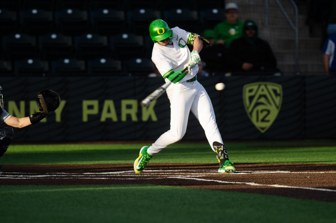 Ducks outfielder (26) Colby Shade hits a drive to center field. The University of Oregon Ducks defeat Xavier University 3-2 at PK Park in Eugene, Ore., on February 17th, 2023. (Kai Kanzer/Emerald)