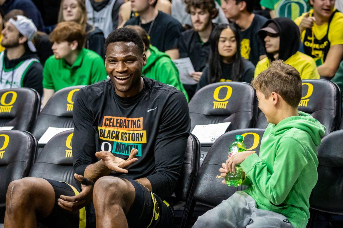 Oregon center, N'Faly Dante, laughs with a young fan during warmups.&#160;The Oregon Ducks host the #7 ranked UCLA Bruins at Matthew Knight Arena in Eugene, Ore., on Feb. 13th, 2023. (Jonathan Suni, Emerald)